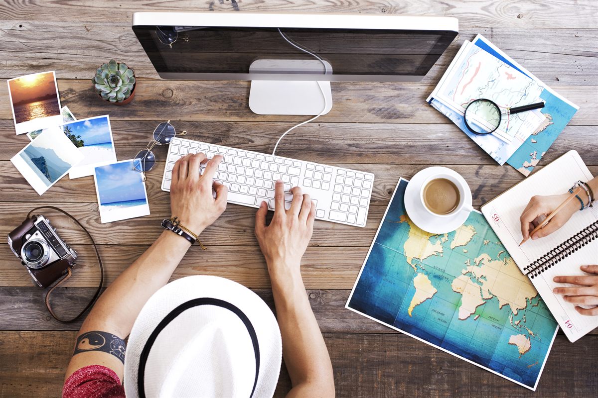 Trip planning desk with a map and camera